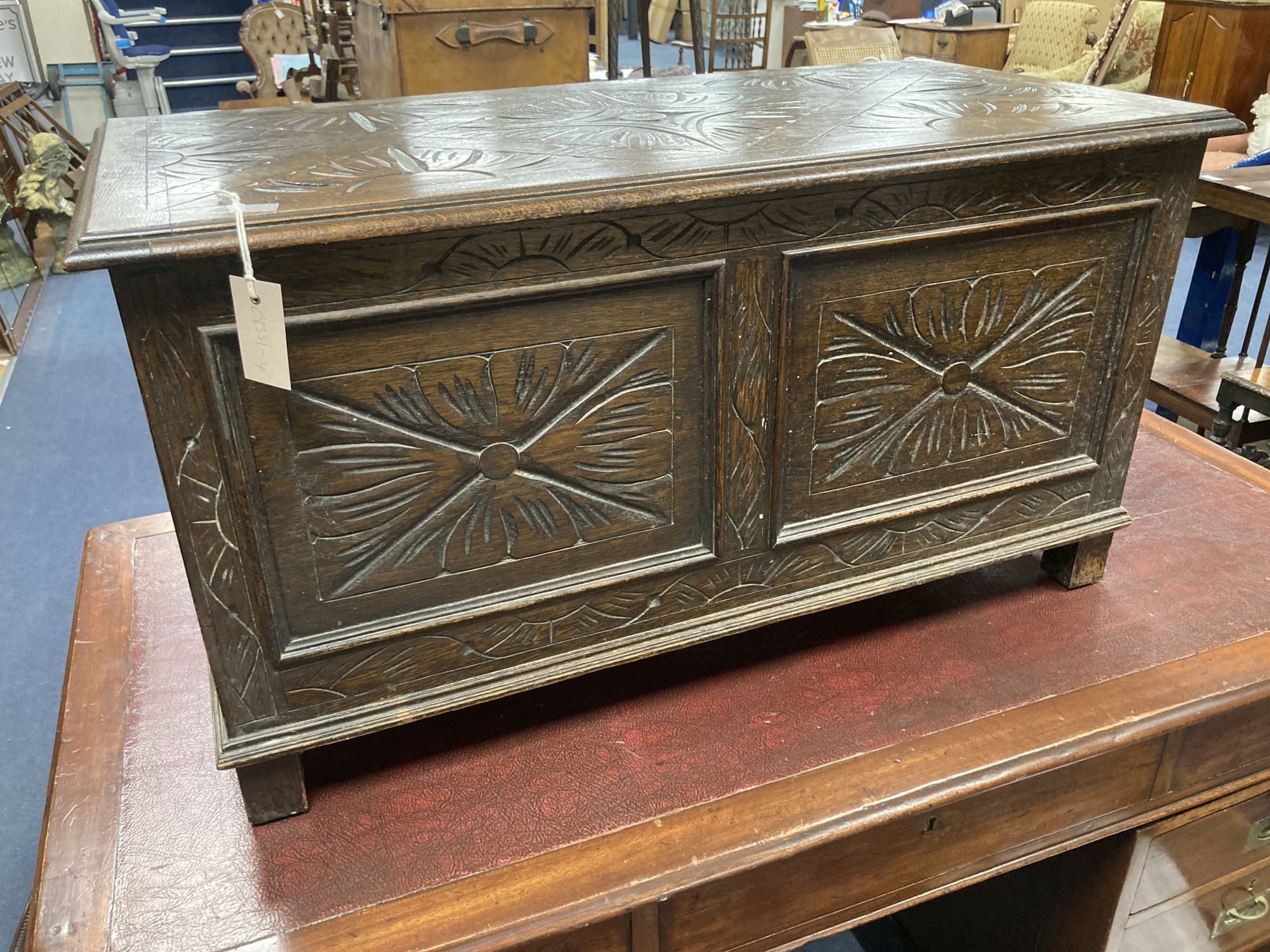 A small 18th century style carved oak coffer, width 90cm, depth 45cm, height 48cm